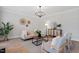 This cozy living area includes warm lighting, a stylish cabinet, and comfortable seating at 3439 Archdale Dr, Raleigh, NC 27614