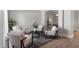 Relaxing room with four chairs centered around a modern table at 3439 Archdale Dr, Raleigh, NC 27614