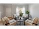 Relaxing room with four chairs centered around a modern table at 3439 Archdale Dr, Raleigh, NC 27614