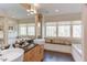 Bathroom with dual sinks, granite countertop, soaking tub, and a large window at 3604 Pasture Rd, Hillsborough, NC 27278