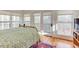 Bright bedroom with wood floors, lots of windows, and a view of the forest at 3604 Pasture Rd, Hillsborough, NC 27278