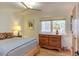 Bedroom with a bed, dresser, and a natural view at 3604 Pasture Rd, Hillsborough, NC 27278