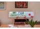 Spacious dining area with natural lighting, wooden floors, and view to front garden at 3604 Pasture Rd, Hillsborough, NC 27278