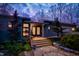 Charming home featuring stone walkway, wooden steps, and a beautifully illuminated entryway at 3604 Pasture Rd, Hillsborough, NC 27278