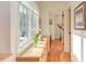 Hallway with hardwood floors, a window with view, and a cabinet at 3604 Pasture Rd, Hillsborough, NC 27278