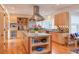 This eat-in kitchen features stainless steel appliances, light wood cabinets, and a central island at 3604 Pasture Rd, Hillsborough, NC 27278