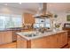 Bright kitchen features stainless steel appliances, granite counters, and ample cabinet space at 3604 Pasture Rd, Hillsborough, NC 27278