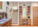Brightly lit office space has built in shelving, drawers, and space for a chair at 3604 Pasture Rd, Hillsborough, NC 27278