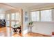 Sitting room has a piano, lots of natural light and hardwood floors at 3604 Pasture Rd, Hillsborough, NC 27278