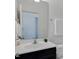 Bathroom featuring a dark vanity and white countertop sink at 3924 Volkswalk Pl, Raleigh, NC 27610