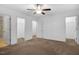 A bedroom featuring neutral carpet and walls, with entries to other areas of the home at 3924 Volkswalk Pl, Raleigh, NC 27610