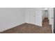 Bedroom with neutral walls and carpet and a door leading to another room at 3924 Volkswalk Pl, Raleigh, NC 27610