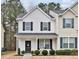 Charming two-story home with covered porch and manicured landscaping at 3924 Volkswalk Pl, Raleigh, NC 27610