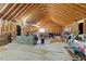Spacious unfinished attic, featuring exposed rafters and ample room for storage or future expansion at 4014 Peeler Ct, Rolesville, NC 27571
