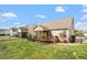 Home with screened-in porch, green lawn, landscaping, and fenced backyard at 4014 Peeler Ct, Rolesville, NC 27571