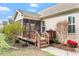 Backyard view of screened porch, grill deck, manicured lawn and privacy landscaping at 4014 Peeler Ct, Rolesville, NC 27571
