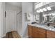 Bathroom featuring double sinks with granite countertops and a glass-enclosed shower at 4014 Peeler Ct, Rolesville, NC 27571