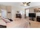 Spacious bedroom with carpet flooring, a large window, and a view of a chest of drawers and TV at 4014 Peeler Ct, Rolesville, NC 27571