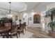 Bright dining area with a view of an decorative wall and a stone alcove, complemented by a large dining table at 4014 Peeler Ct, Rolesville, NC 27571
