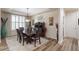 Formal dining room featuring a large table, elegant lighting, and access to other areas of the home at 4014 Peeler Ct, Rolesville, NC 27571
