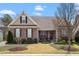 Charming single-story home boasts stone accents, manicured lawn, and inviting front porch at 4014 Peeler Ct, Rolesville, NC 27571