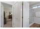 View from hallway of bedroom and bath areas, showing neutral walls and light fixtures at 4014 Peeler Ct, Rolesville, NC 27571