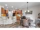 Open concept kitchen and dining area with breakfast bar and modern decor at 4014 Peeler Ct, Rolesville, NC 27571