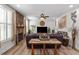 Inviting living room with a stone fireplace, modern decor, and lots of natural light from large windows at 4014 Peeler Ct, Rolesville, NC 27571