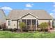 Beautiful rear exterior with a charming screened porch and well-maintained landscaping at 4014 Peeler Ct, Rolesville, NC 27571
