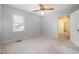 Bedroom featuring carpeted floors, neutral walls, ceiling fan, and natural light at 410 E Mcneill St, Lillington, NC 27546