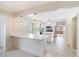 Bright kitchen with marble countertops, stainless steel appliances, and an open view to an adjoining room at 410 E Mcneill St, Lillington, NC 27546
