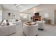Bright living room featuring contemporary furniture, a fireplace, and an open-concept view to the kitchen at 410 E Mcneill St, Lillington, NC 27546