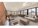Inviting sunroom with abundant natural light, comfortable seating, and a dining area, perfect for relaxation at 410 E Mcneill St, Lillington, NC 27546