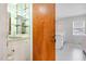 The wet bar has an interesting door and is located adjacent to a kitchen or living area at 410 E Mcneill St, Lillington, NC 27546