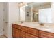 Bathroom featuring a double vanity, framed mirror and enclosed shower at 430 Easy Wind Ln, Garner, NC 27529