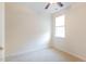 This bedroom features neutral carpet, a ceiling fan, and a bright window at 430 Easy Wind Ln, Garner, NC 27529