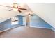 Bonus room features vaulted ceilings, three fans, and carpeted flooring at 430 Easy Wind Ln, Garner, NC 27529