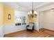 Inviting dining area with yellow walls, white trim, and a window with natural light at 430 Easy Wind Ln, Garner, NC 27529