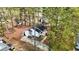 Aerial view of a cozy home surrounded by mature trees, showing the property's layout and neighborhood at 432 Fowlkes St, Wendell, NC 27591