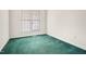 Bedroom with window and wall-to-wall green carpet at 432 Fowlkes St, Wendell, NC 27591