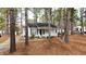 Charming one-story home nestled among trees with a welcoming front porch and landscaped garden at 432 Fowlkes St, Wendell, NC 27591