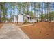 Inviting one-story home featuring a well-kept lawn, brick accents, and a private driveway at 432 Fowlkes St, Wendell, NC 27591