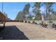 Expansive backyard featuring an outdoor seating area, perfect for entertaining, on a sunny day at 4913 Sunset Stream Dr, Fuquay Varina, NC 27526