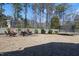 Backyard with a stone patio and a trampoline; perfect for relaxing or playing at 4913 Sunset Stream Dr, Fuquay Varina, NC 27526