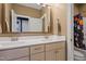 Bathroom features a double sink vanity with a framed mirror and cabinets at 4913 Sunset Stream Dr, Fuquay Varina, NC 27526