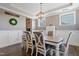 Well-lit dining room featuring stylish chandelier and neutral decor, ideal for meals and entertaining at 4913 Sunset Stream Dr, Fuquay Varina, NC 27526