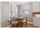 Cozy breakfast nook features a charming window and a comfortable table perfect for enjoying meals at 4913 Sunset Stream Dr, Fuquay Varina, NC 27526