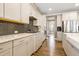 Modern kitchen with stainless steel appliances, gas cooktop and quartz countertops, lots of storage space at 4913 Sunset Stream Dr, Fuquay Varina, NC 27526