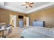 A view of the main bedroom, with multiple dressers and easy access to an ensuite bathroom at 4913 Sunset Stream Dr, Fuquay Varina, NC 27526