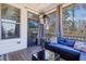 Cozy covered patio area with stylish seating, a glass table, and exterior view at 4913 Sunset Stream Dr, Fuquay Varina, NC 27526